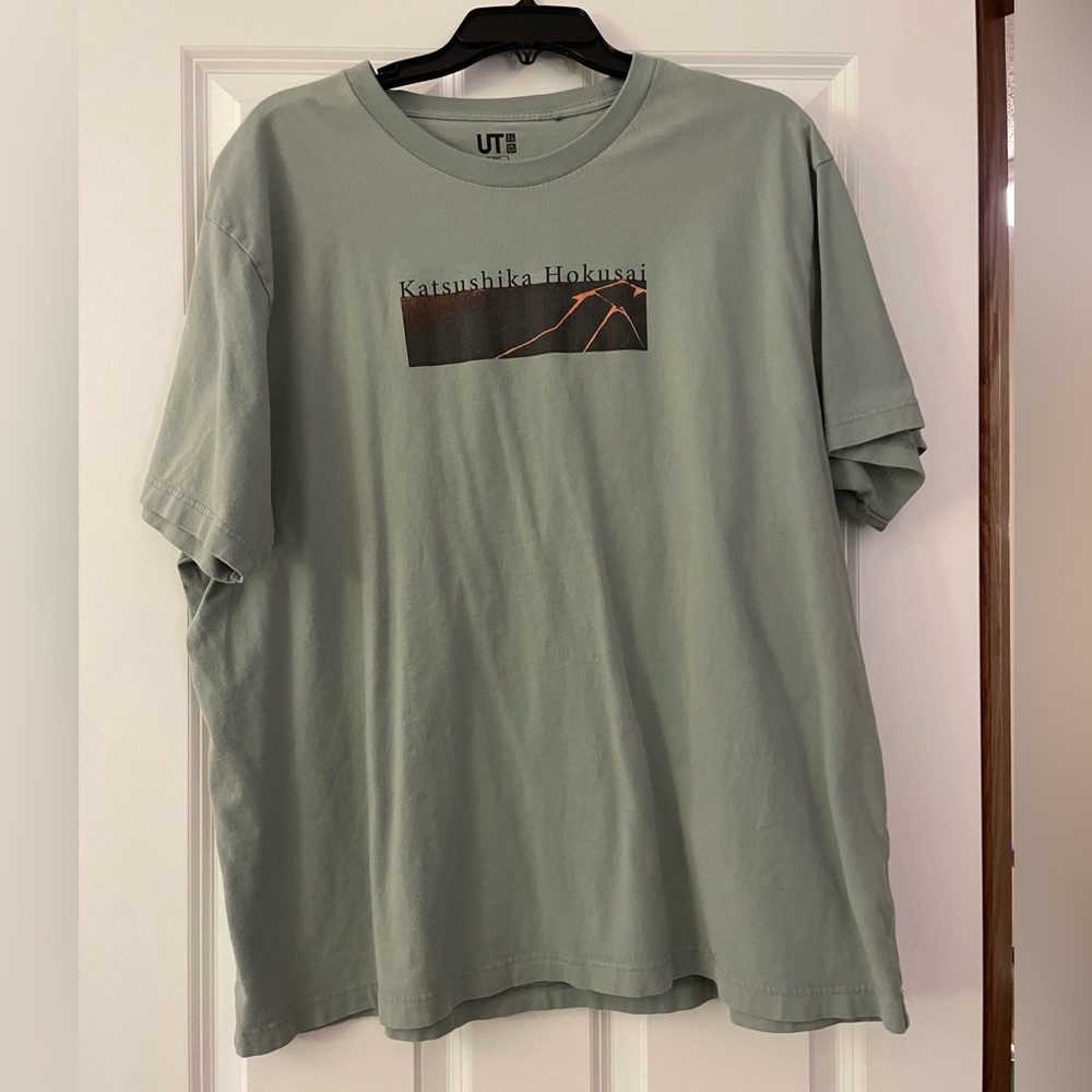 Green t-shirt with mountain design